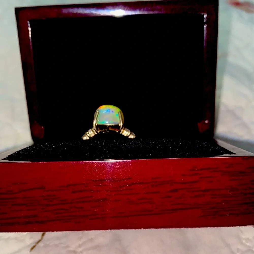 AAA Ethiopian Welo 7.56 cwt Opal and G-H SI Diamond Ring in 10 k gold size 7